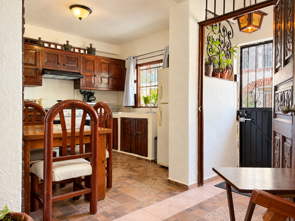 Charming wood-accented kitchen with cozy dining and character-filled entry