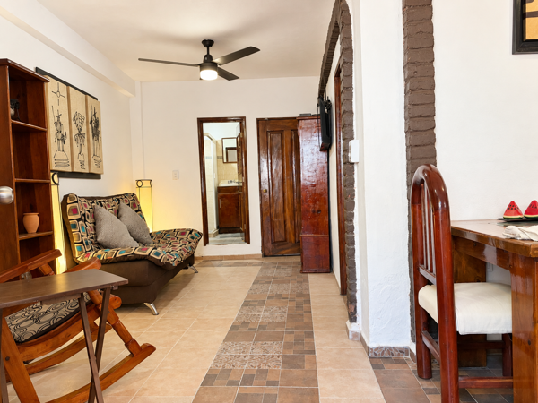 Cozy interior with warm wood accents, dining nook, and charming archways