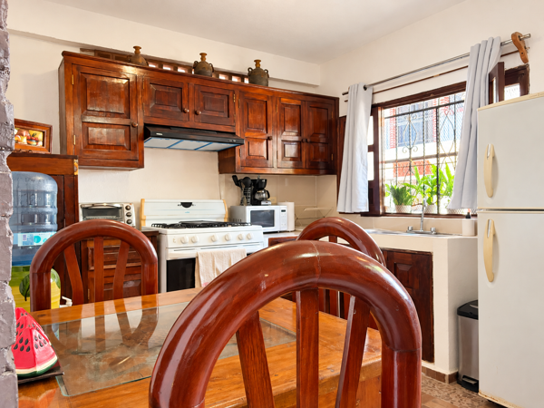 Warm rustic kitchen with dining space and plenty of natural light