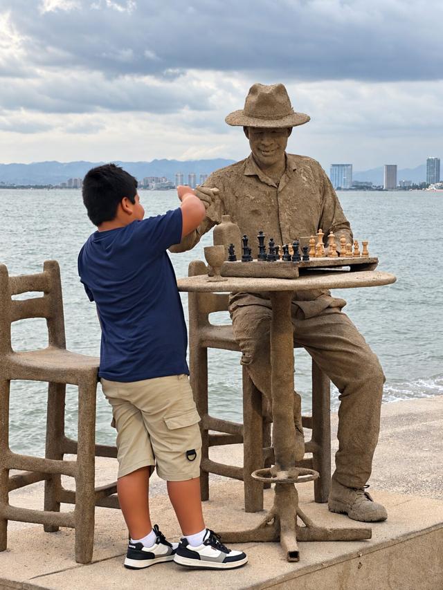 Puerto Vallarta waterfront sculpture and chess scene by the bay