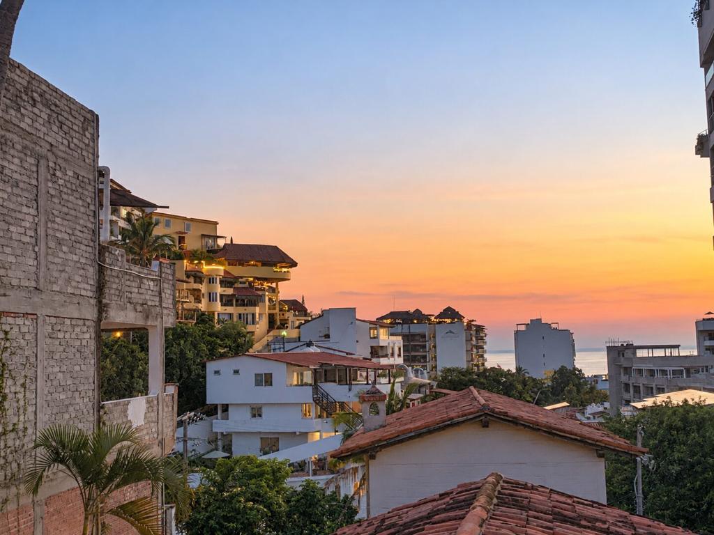 Rooftops and hillside homes of Puerto Vallarta at dusk