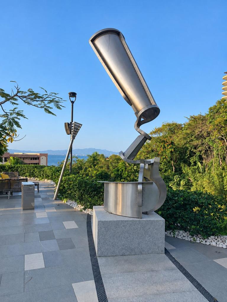 Stainless steel sculpture on a terrace overlooking the sea
