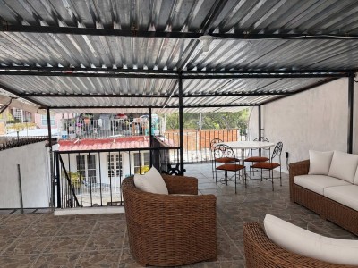 Covered shared rooftop terrace at Casa Rodriguez